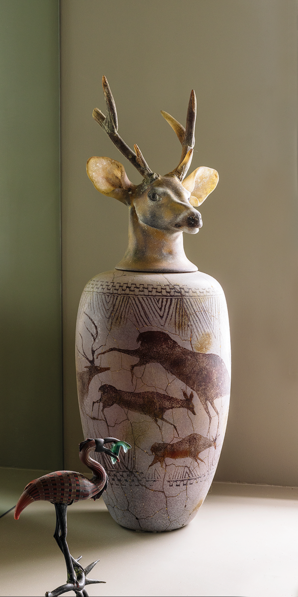 JAR: William Morris, Canopic Jar: Buck, 1993, blown glass, manipulated while hot, 37.75 x 12.5 in (diameter).  BIRD: William Morris, untitled, date unknown, glass, 12 x 8.25 x 4.75 in. Photo by Alanna Hale.
