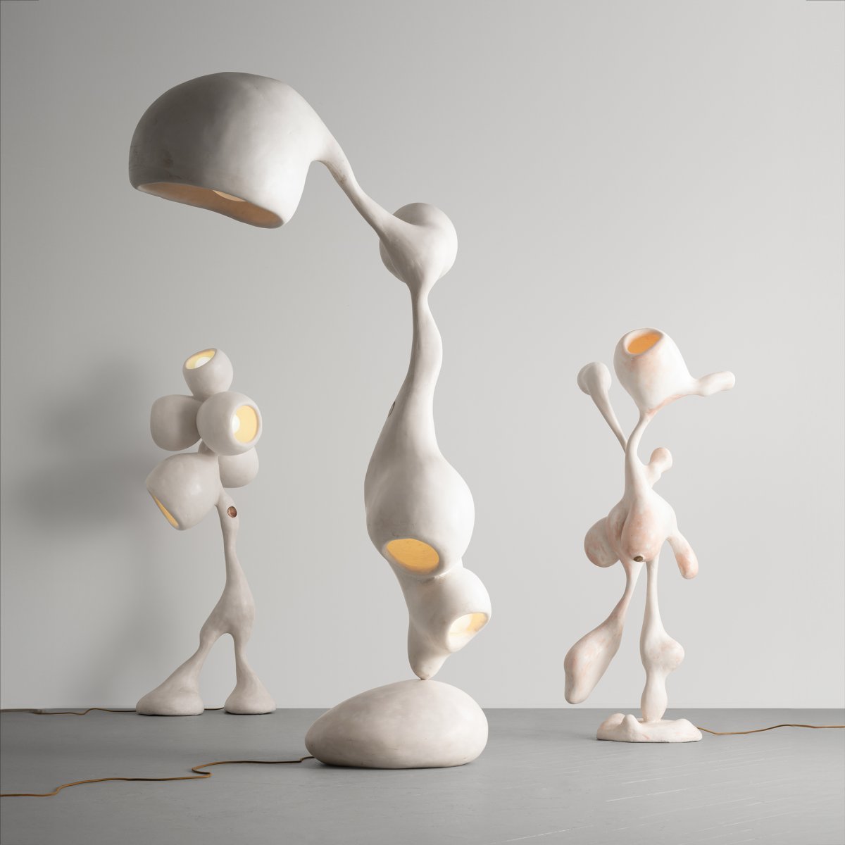 Rogan Gregory’s gypsum lamps including (left to right) Loe Depositor, 2022, 66 x 31 in.; Ovorepository, 2022, 91 x 24 in.; and Tiny Dancer (Ballerina), 2022, 68 x 18 x 22 in. Photo by Joe Kramm, courtesy of R & Company.