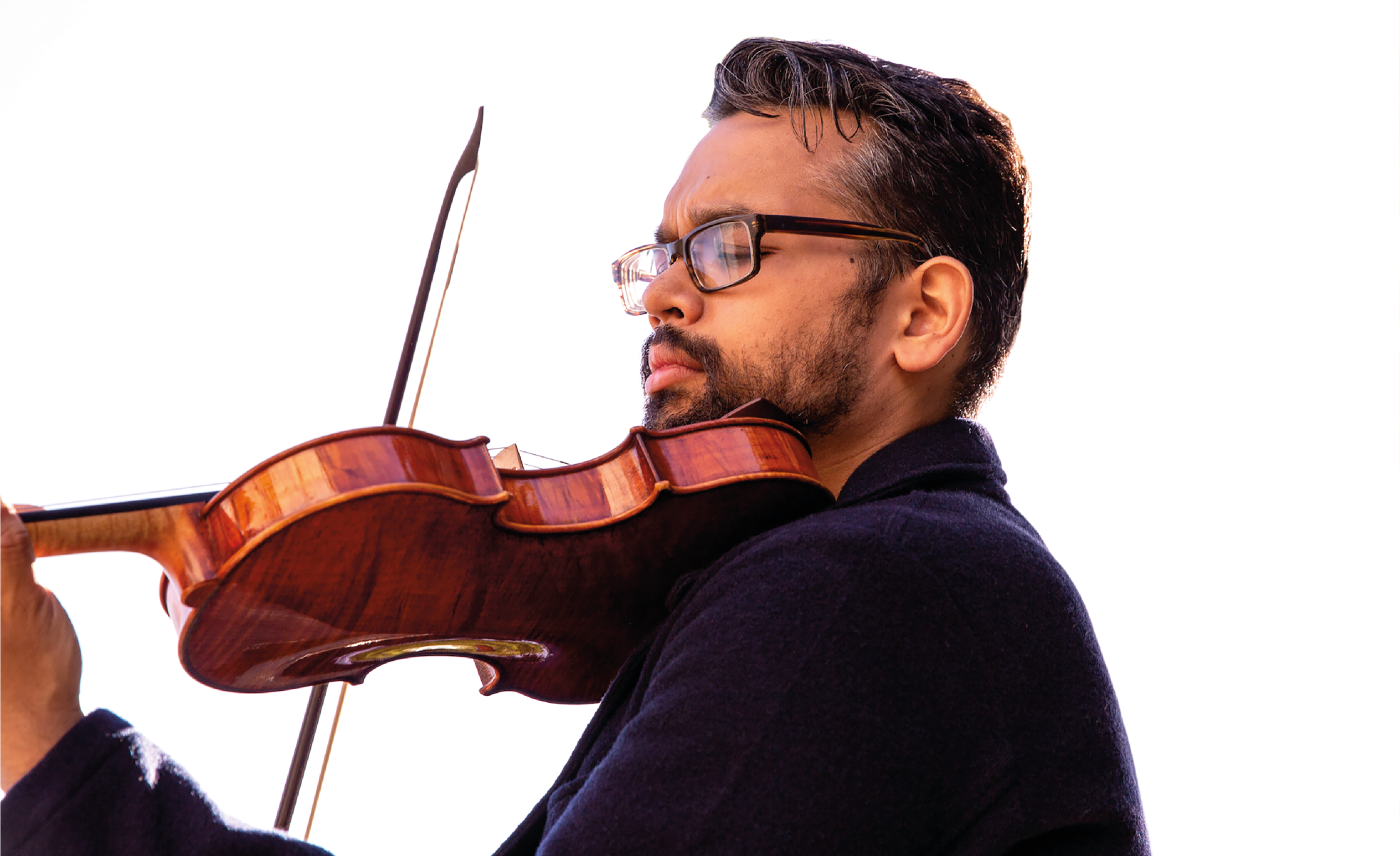 Vijay Gupta makes beautiful music on one of Benning’s lovingly crafted violins. Photo by Kat Bawden.