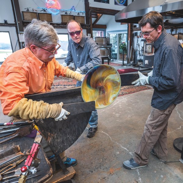 Simpson with his 2 assistants working to transfer and finish a disk in his studio.