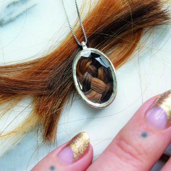 Necklace with hair placed in its center.