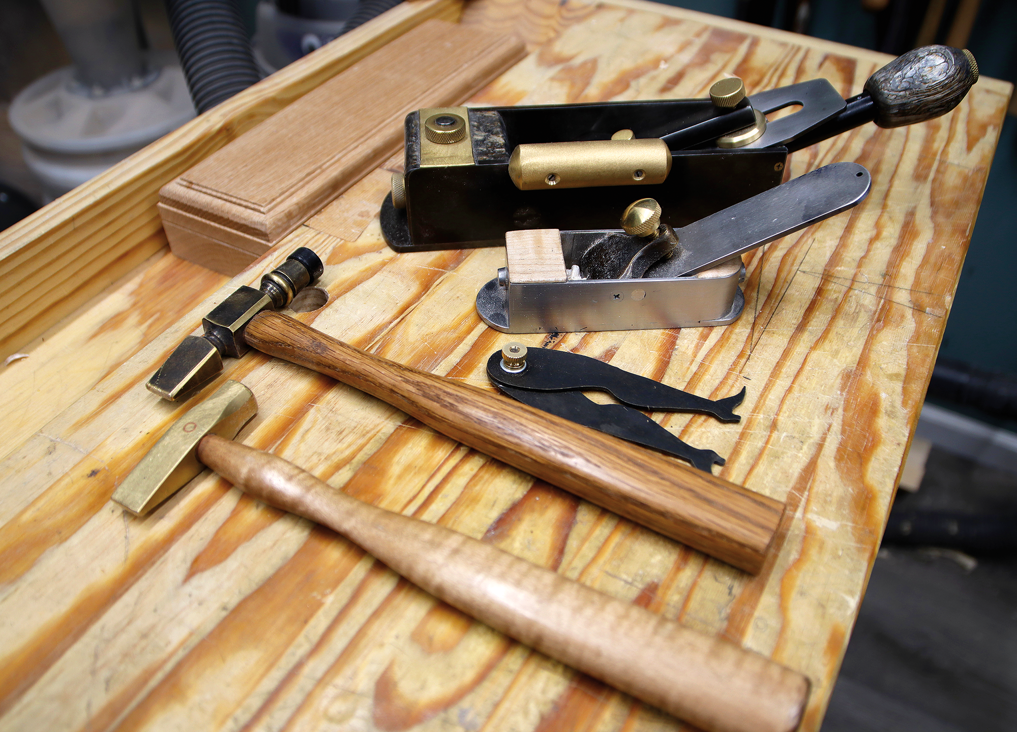 Meyer made these tools, including steel hand planes, a pair of Dancing Master calipers, and brass-head hammers.