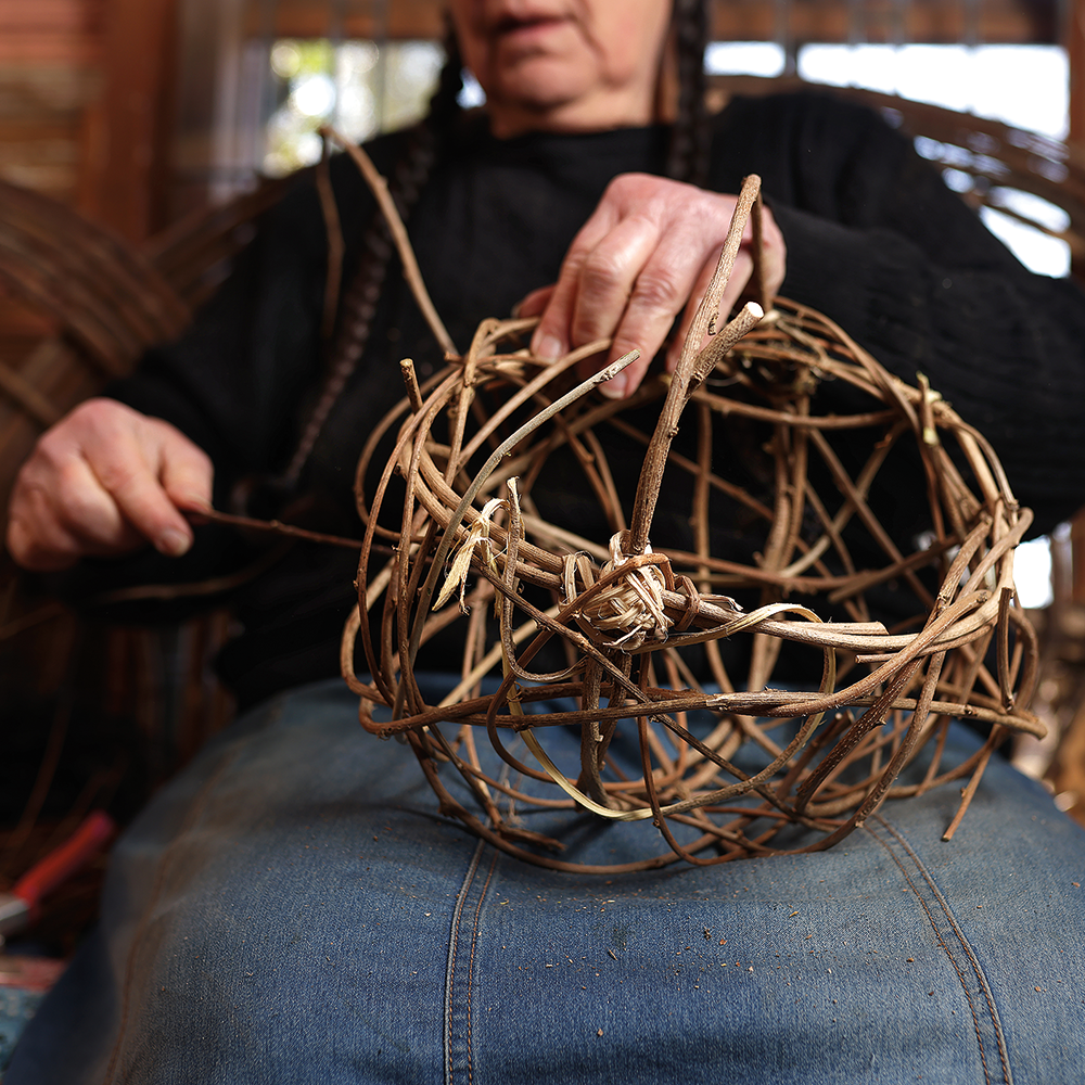 Basket shows how to make a ribbed basket from kudzu, wisteria, Cherokee sweet shrub, autumn olive, and other vines from her yard. 