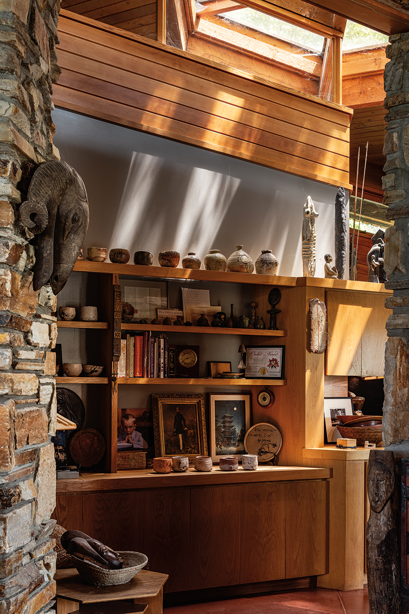 A view into the library and kitchen, which Whiting redesigned in 1982, reveals how he displays his collection of tea bowls and ceramics.