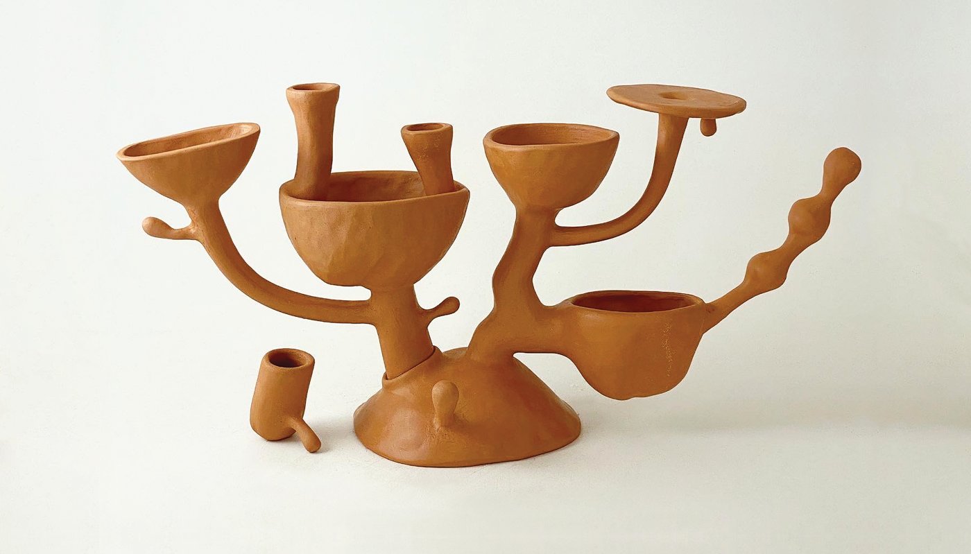 Earthenware designed to resemble a candelabra. 