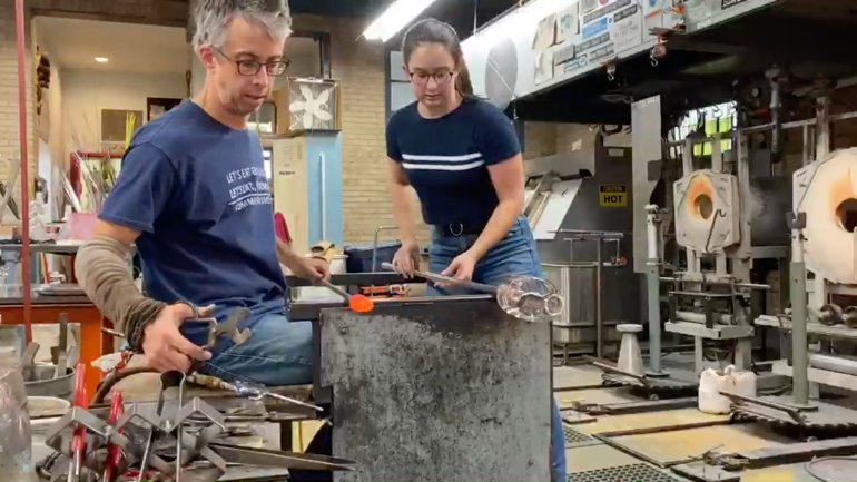 Glass artist Fred Kaemmer working with his daughter in his studio
