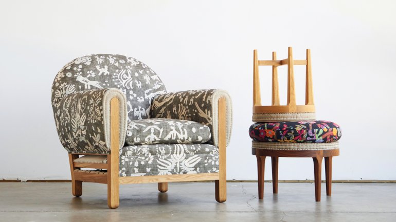 set of three handmade furniture pieces made with traditional upholstery techniques—a club chair and an ottoman with a stool stacked on top of it