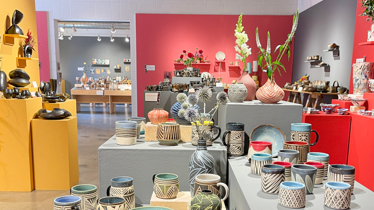 Part of a Northern Clay Center fundraiser, this installation features the work of Donna DeSoto in the foreground. Photo courtesy of Northern Clay Center.