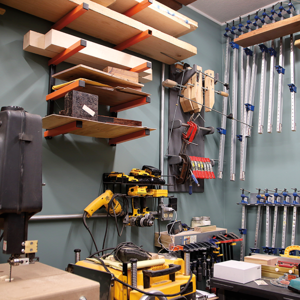 Meyer's space features assorted drills, clamps, and wood pieces.