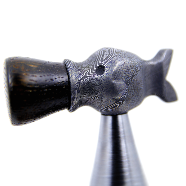 The decorative top of Meyer’s fish head hammer, used for plane setting, is made from a combination of 1095 and 15N20 steel.
