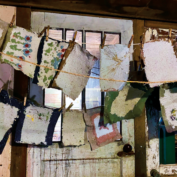 While kudzu paper dries on a clothesline, water drips onto a plastic sheet and then into an ice cream bucket that’s emptied outside on willow withies. “Water is honored here,” Basket says. 