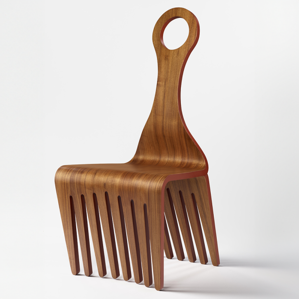 Ethiopian American designer Jomo Tariku combined ceremonial seating and the iconic Afro comb in his 2021 walnut Meedo Chair, 37.25 x 17 x 19 in. It appears in Take a Seat at the Philadelphia Museum of Art. Photo courtesy of the Philadelphia Museum of Art.