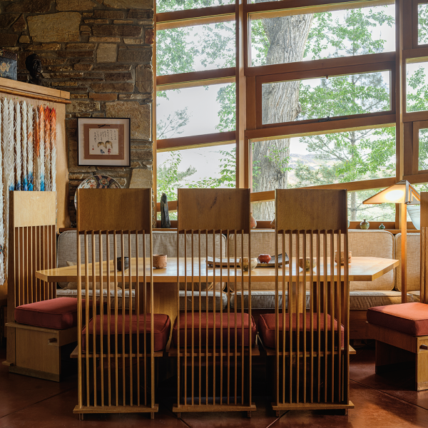 Frank Lloyd Wright’s original dining table and chairs for Teater’s Knoll. A “thousand paper cranes” made by the nieces and nephews of Whiting’s late wife, sculptor Lynn Fawcett Whiting. A watercolor portrait of the Whitings by their neighbor, Masako Robbins. 