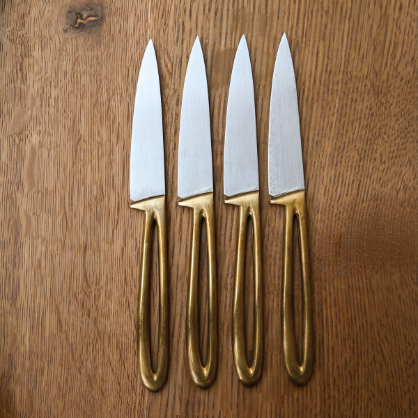 Chef Michael Tusk of Quince in San Francisco commissioned Noel to create these brass-handled stainless steel steak knives for the restaurant’s redesign. Photo by Sarah Huber.