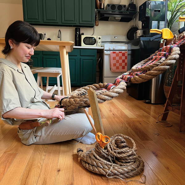 Saito relies on a DeWalt clamp to hold her loom in place. Photo by Izaac Costiniano. 