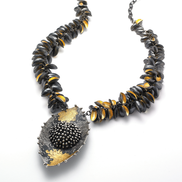 Image of Thistle II, 2014, an oxidized silver, 24k gold leaf necklace chain.