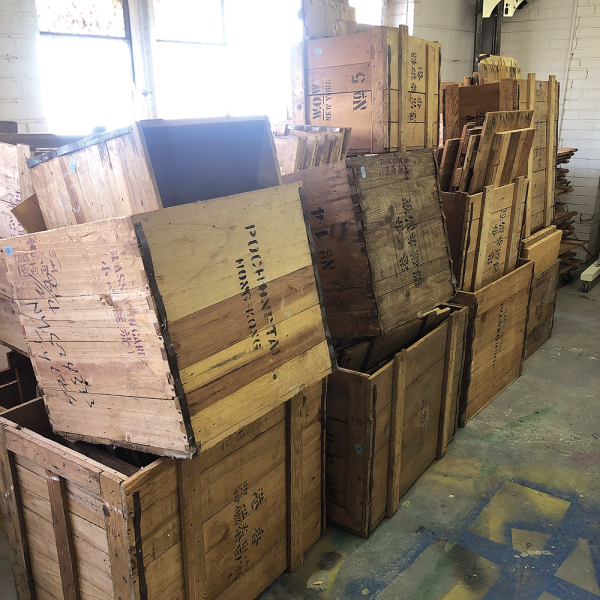 A stack of Wing on Wo & Co. crates wait to be pulled apart and reassembled at Chiu’s studio in Richmond, Virginia. Photo by Vivian Chiu. 