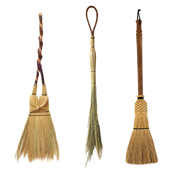 Three brooms made by Friendswood Brooms, Husk Brooms, and Broomtown brooms