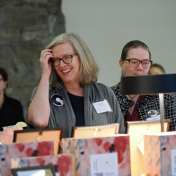 people bidding at a silent auction