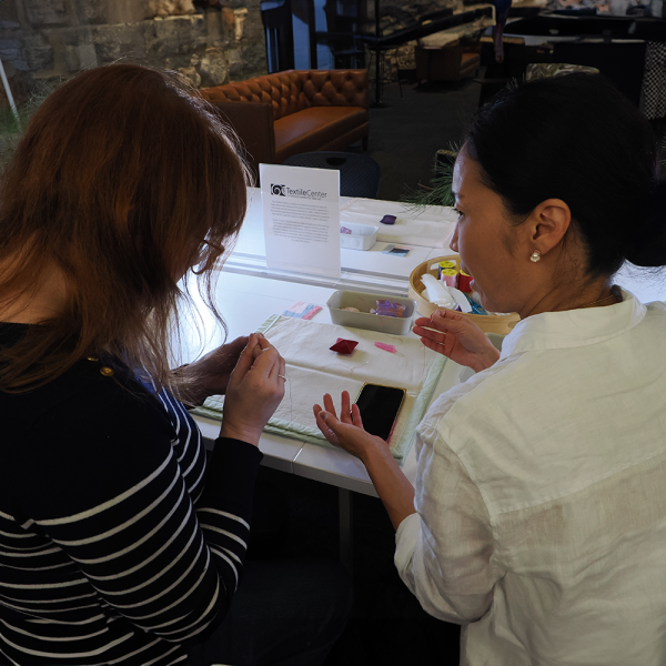 textile artists crafting at a table