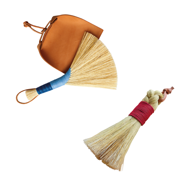 Two brooms made by Sunhouse Craft and SWEVEN