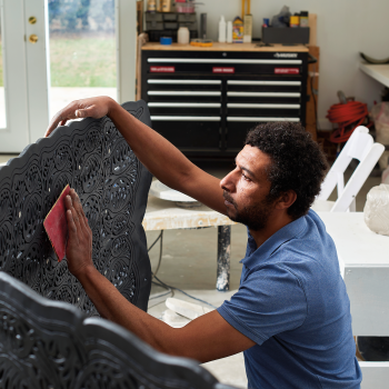 Ibrahim Said working on panels for On the Bank of the Nile. Its geometric shapes, colored Nile green, reflect patterned light. Photos by Dhanraj Emanuel, courtesy of The Clay Studio.