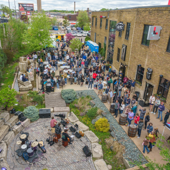 A craft-loving crowd enjoys the Padraigs Brewing patio in the Northeast Minneapolis Arts District during the annual Art-A-Whirl gallery crawl. Photo by Lane Pelovsky.