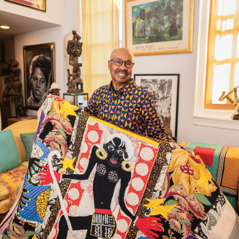 Michael A. Cummings holds his quilt Henri Matisse in Harlem’s Cotton Club, 2018, 78 x 64 in. Photo by Tom Pich. 