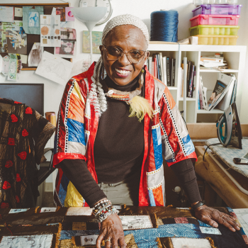 Diana N’Diaye with Ba and Her Daughters, a quilt she made to honor her great grandmother. Photo by Reginald Cunningham.