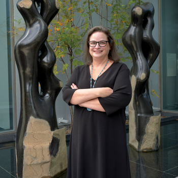 Cindi Strauss acquired the work behind her—Byung Hoon Choi’s basalt sculpture Scholar’s Way, designed in 2017 and made 2017 to 2019—for the Museum of Fine Arts, Houston. Photo by Thomas R. DuBrock.