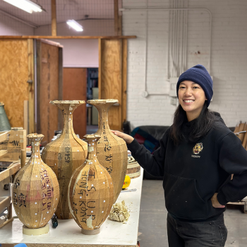 Vivian Chiu with vessels from her Passages (those that carried us) series. Photo courtesy of the artist.