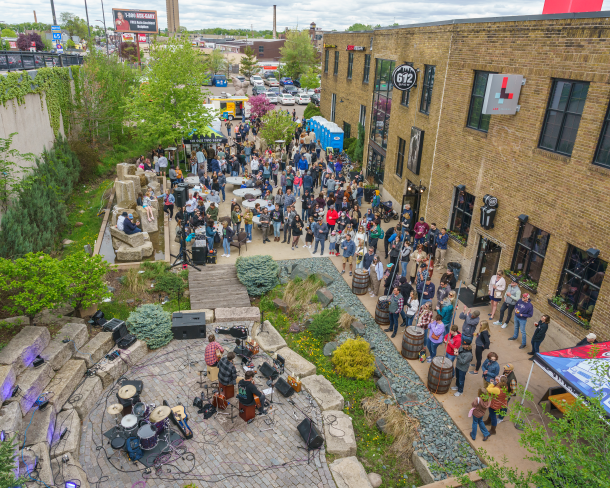 A craft-loving crowd enjoys the Padraigs Brewing patio in the Northeast Minneapolis Arts District during the annual Art-A-Whirl gallery crawl. Photo by Lane Pelovsky.