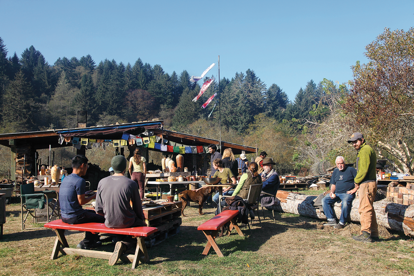 Participants gather with food near Calimpong's kilns.