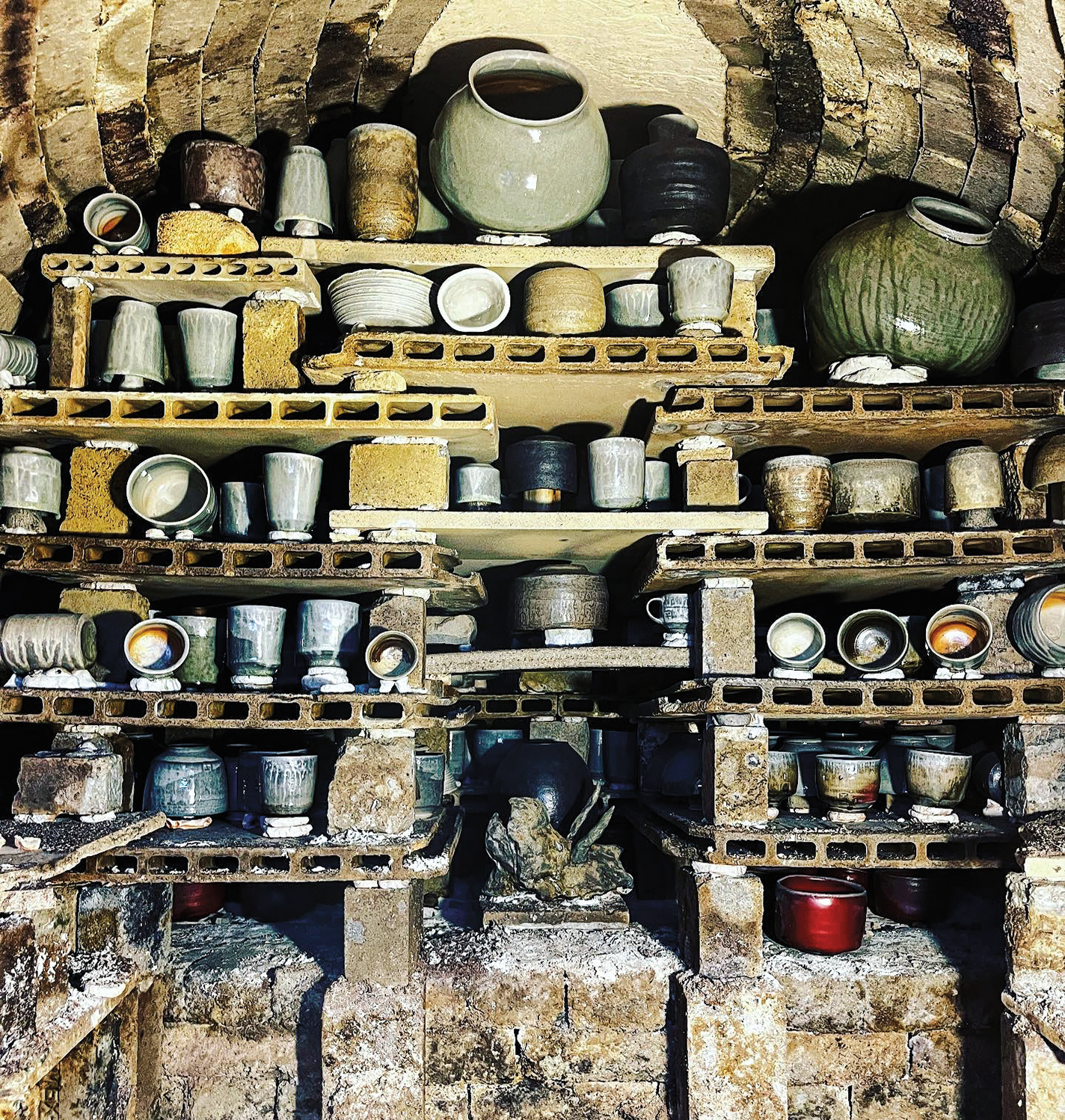 A batch of ceramics ready to be unloaded from a kiln.
