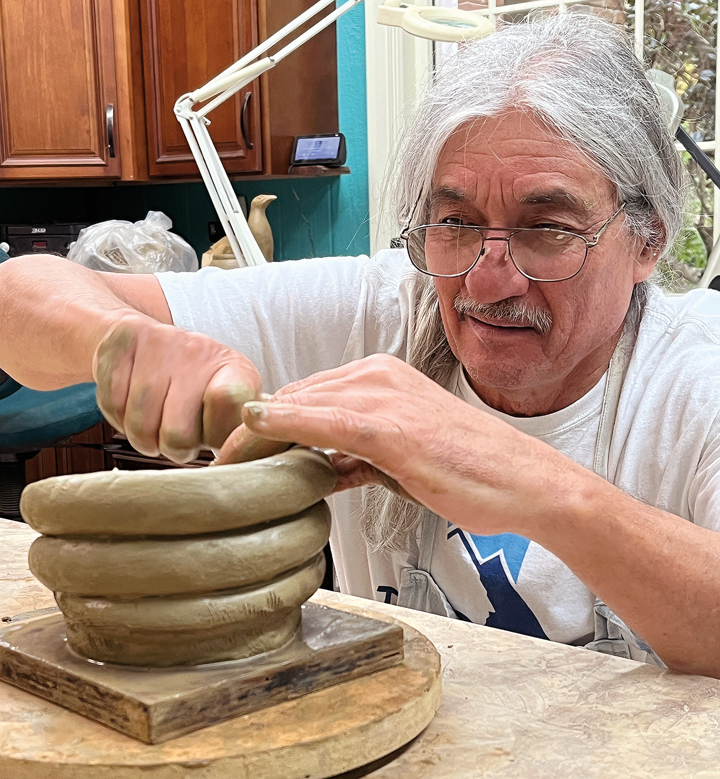 Bill Harris at work, making a vessel with the coil method
