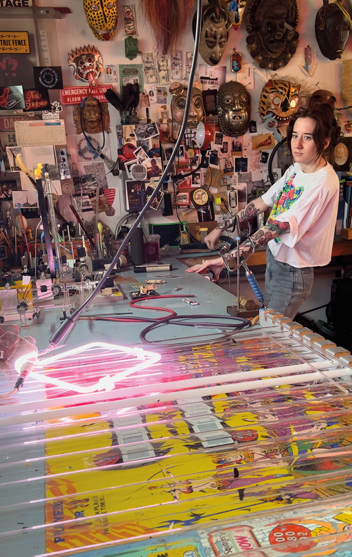 Artist Dani Kaes working at a neon sign shop