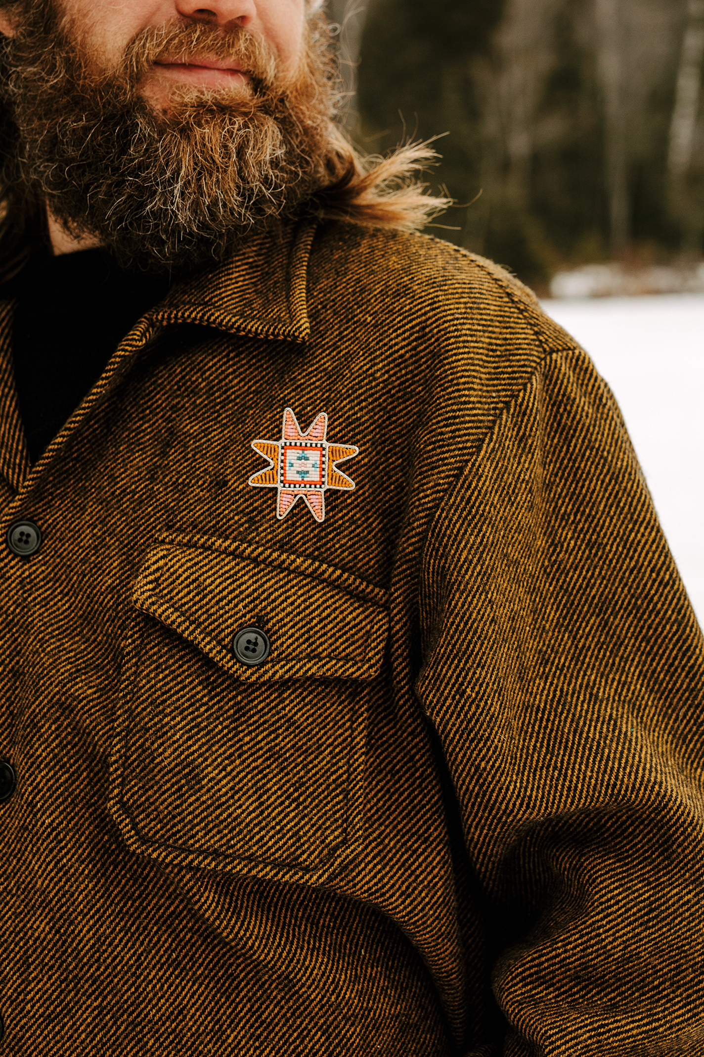 Model wearing beaded pin