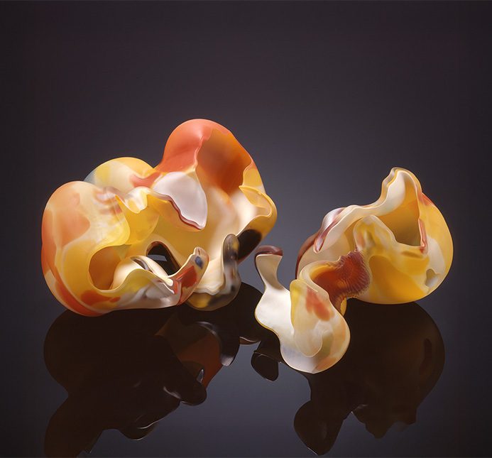 Organic-looking orange and yellow blown glass forms