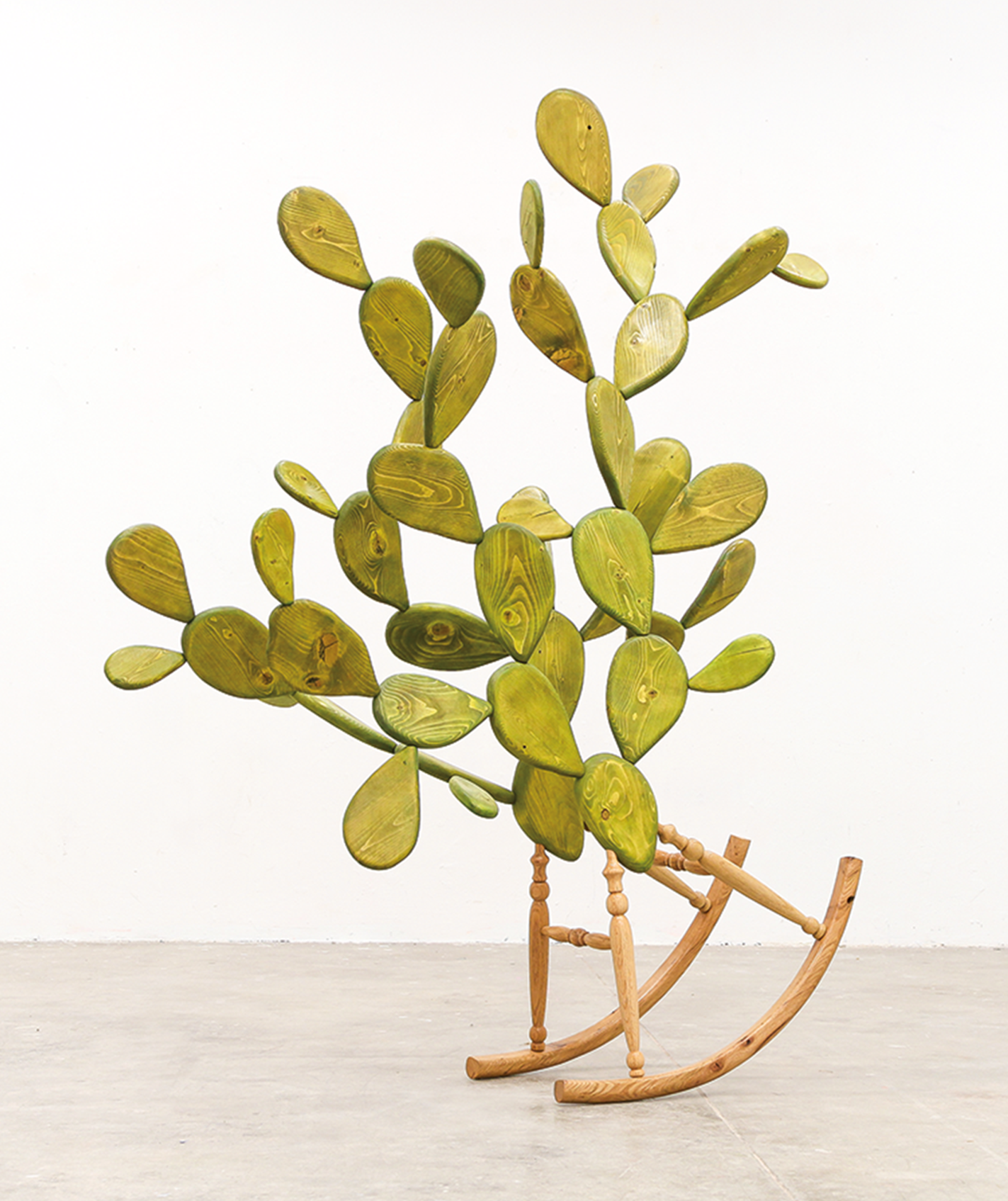 Wooden sculpture blending a cactus and a rocking chair