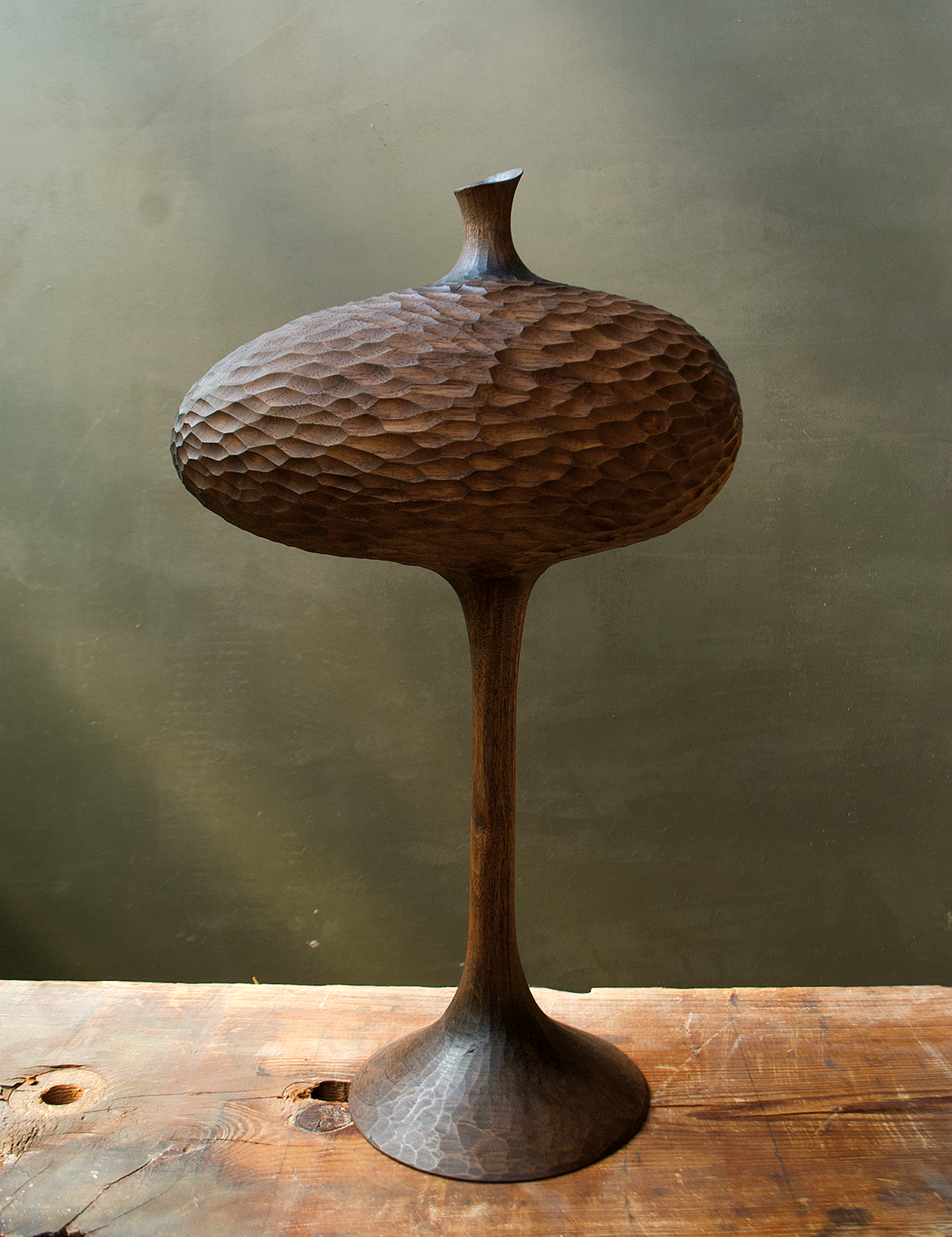 Textured wood vessel with long stem