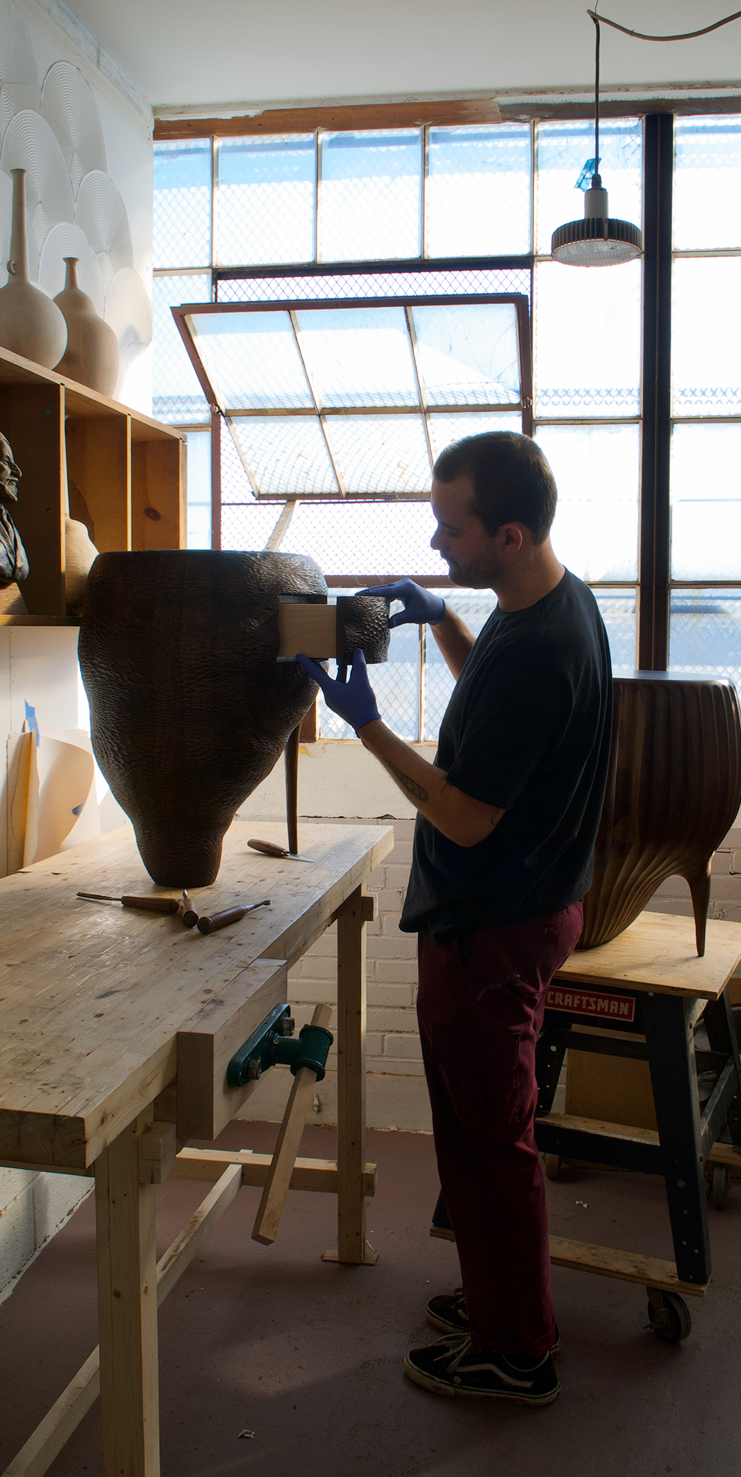 Ashley Joseph Martin works in his studio.