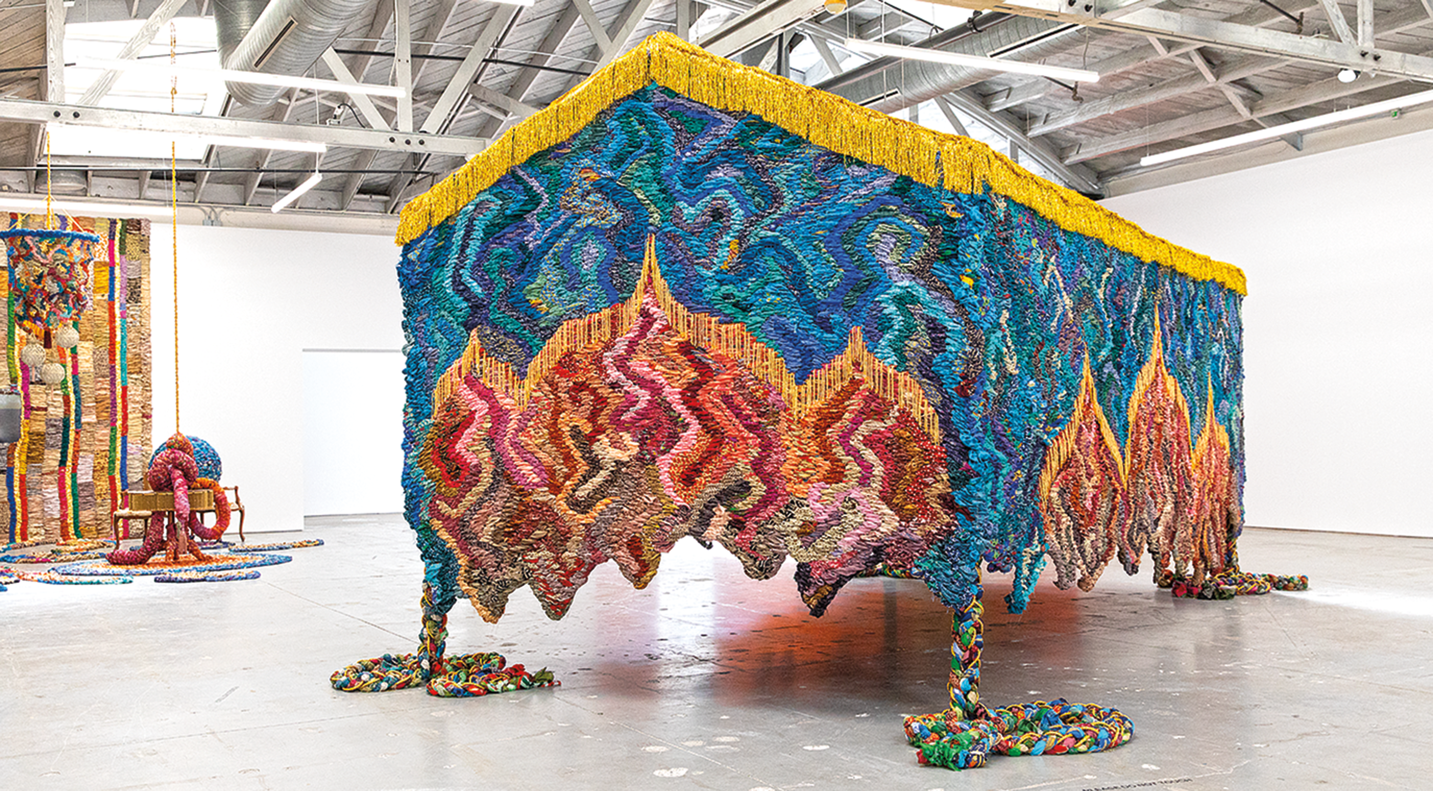 House-like structure is a museum gallery made from repurposed saris.