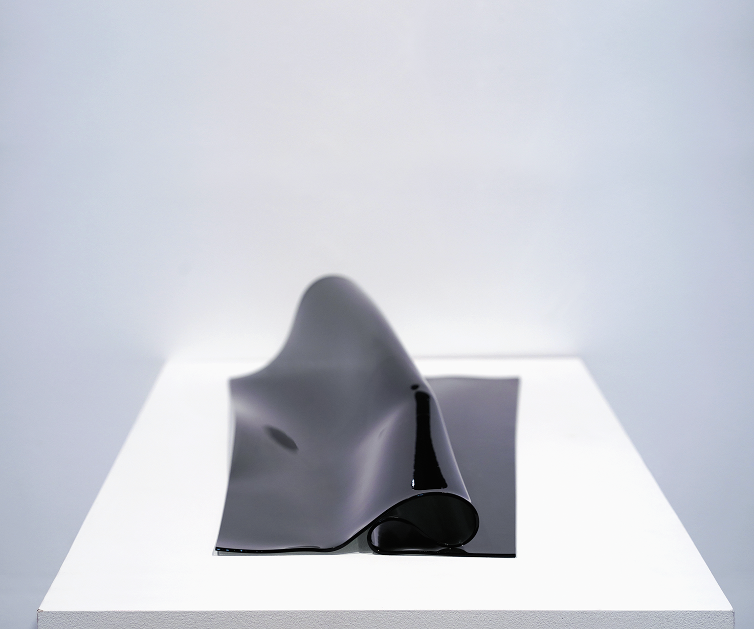 Enfolded black glass sculpture