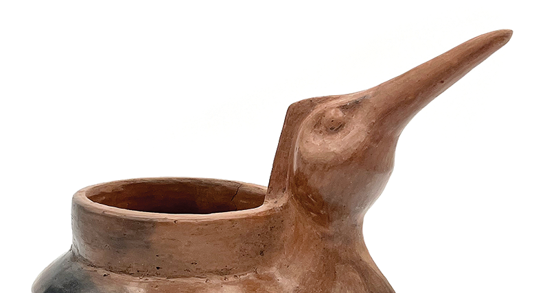 Pottery vase with a bird head