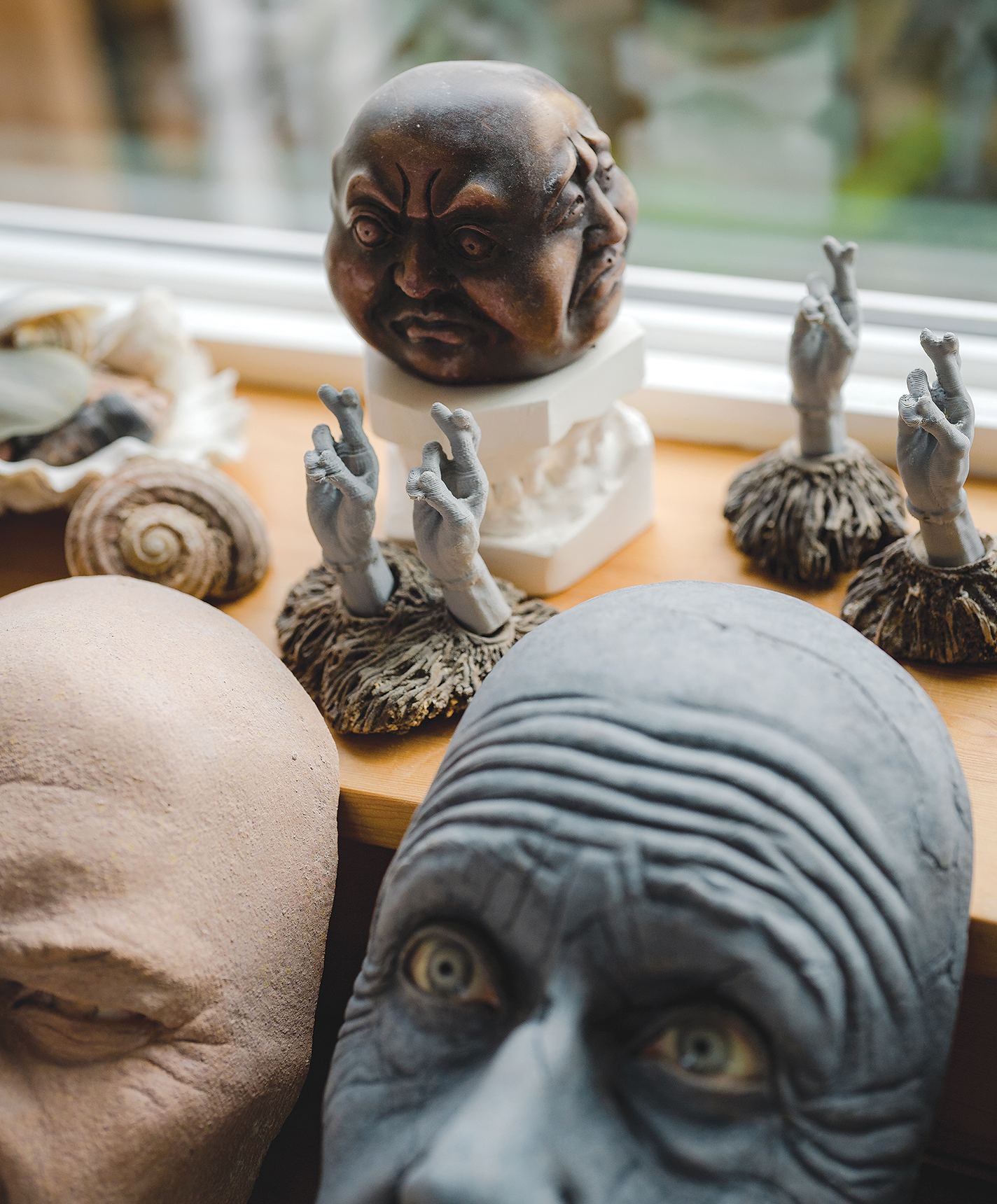Various ceramic heads and body parts in Tip Toland's studio