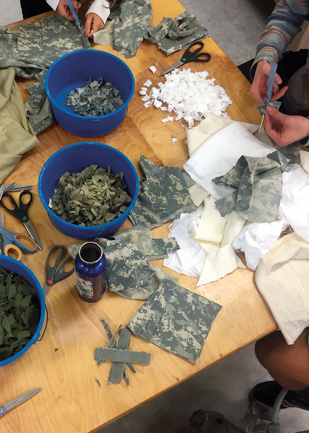 Military uniforms being deconstructed in a workshop at Lewis & Clark College in Oregon.