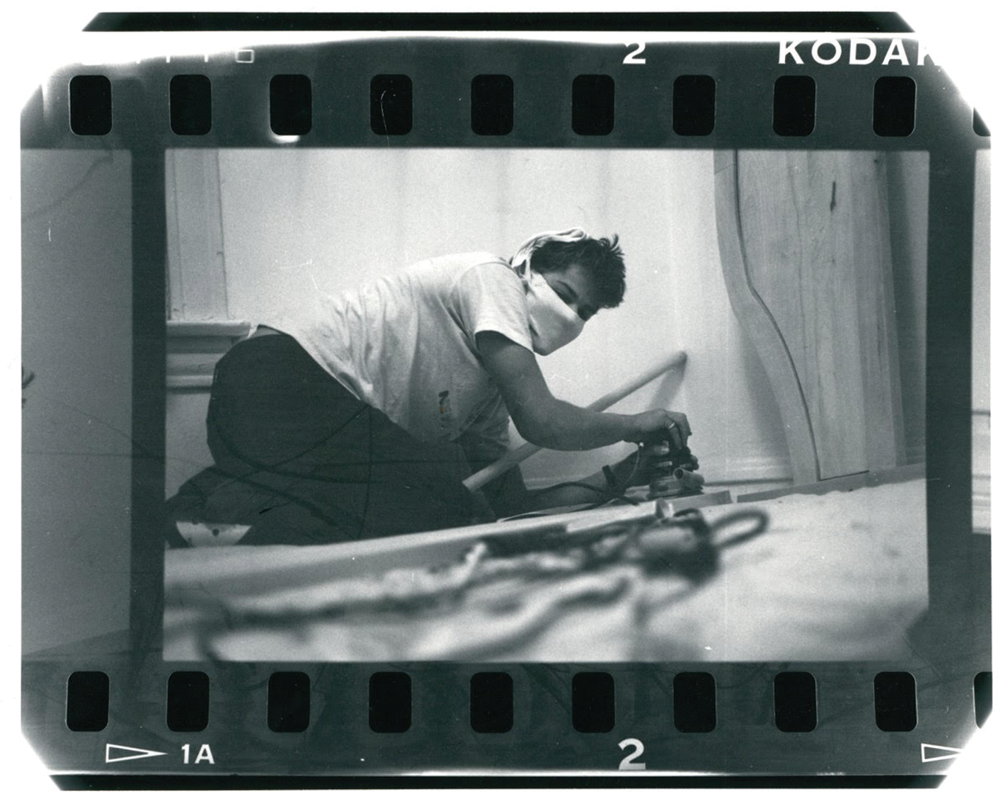 Young Misha Collins wields power tools in his dorm room