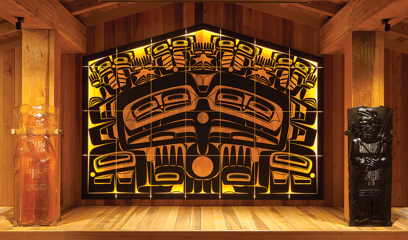 Screen made of kiln-cast and sand-carved panels, cast glass figures