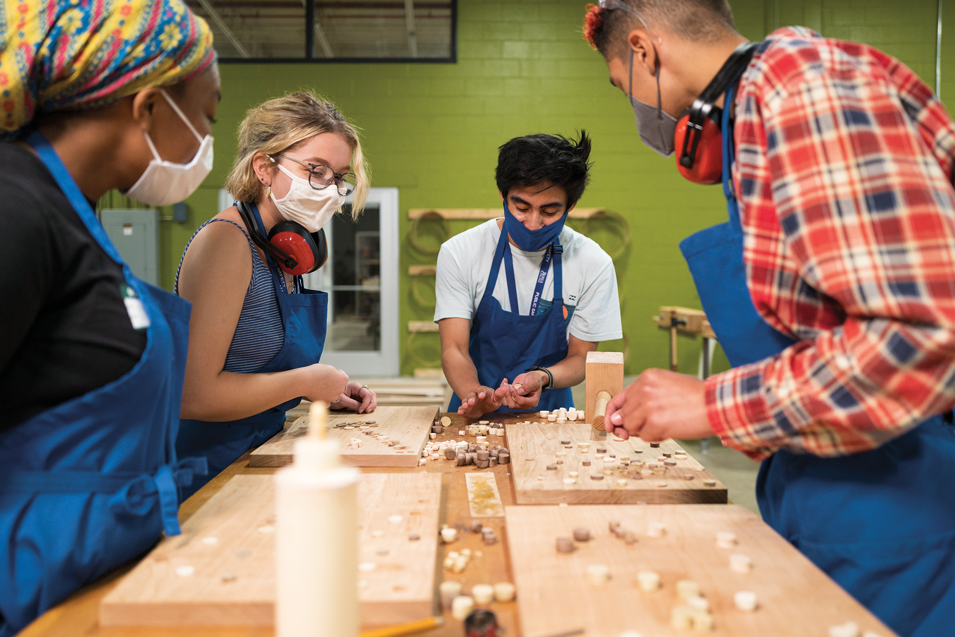 A group of Berea students working with wood
