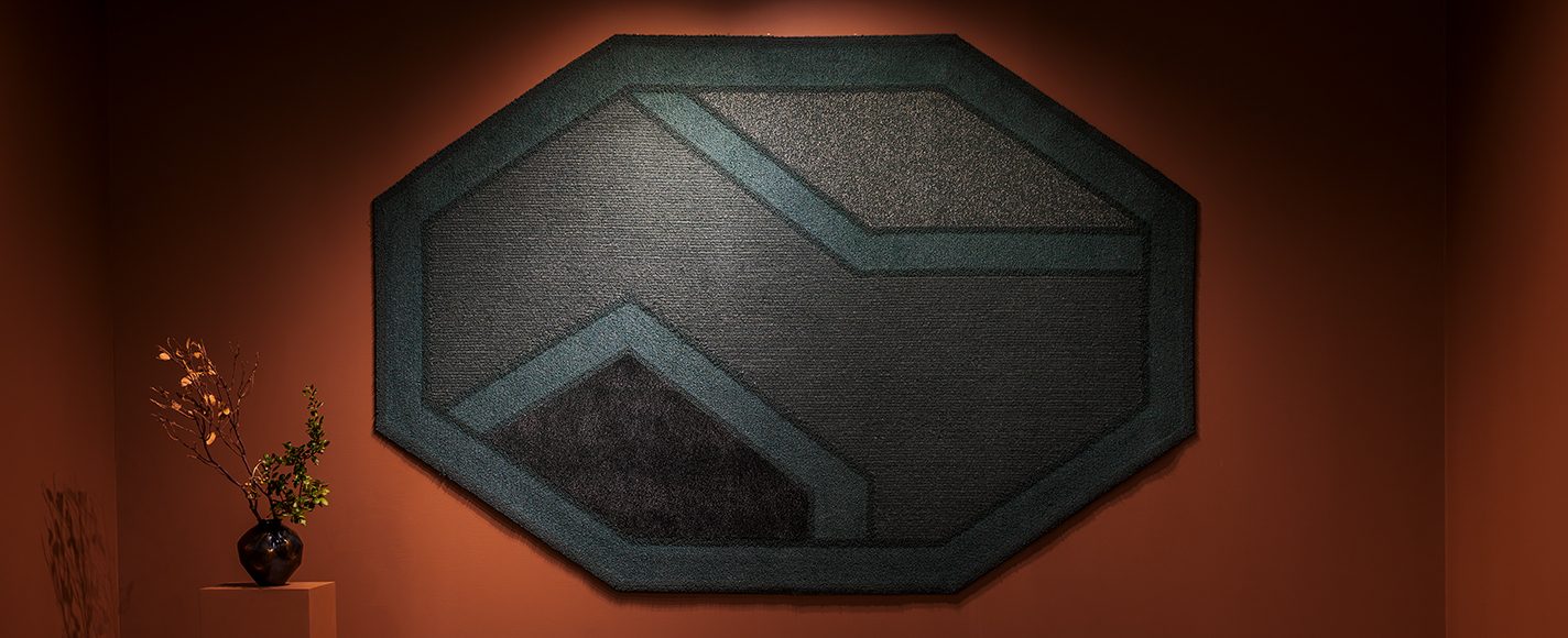 Octagon-shaped rug with geometric pattern by Sylive Johnson for Merida.